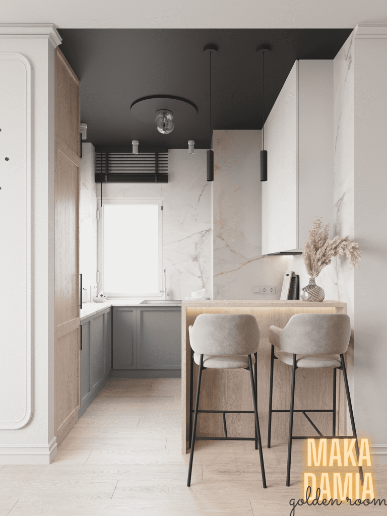 Mała kuchnia w bloku z oknem i półwyspem, jasne fronty i dwa hokery przy blacie – Golden Room