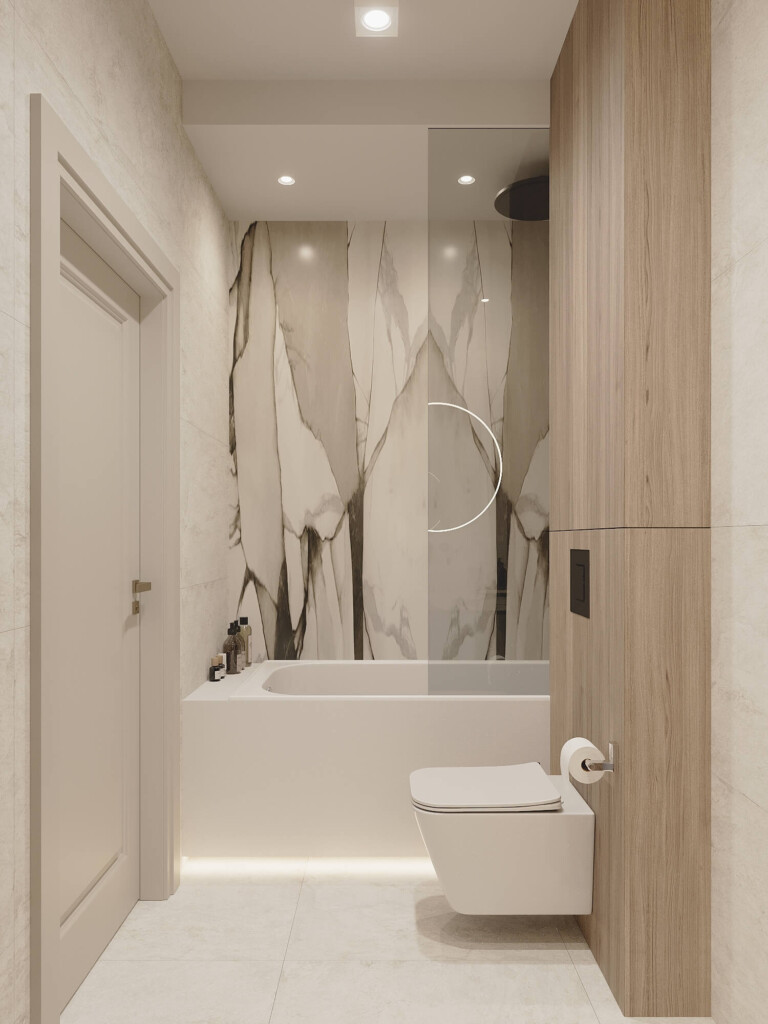 Łazienka 6m2 projekt z wanną ustawioną wzdłuż ściany z dużymi płytami imitującymi kamień i wiszącym WC na tle panelu drewnianego