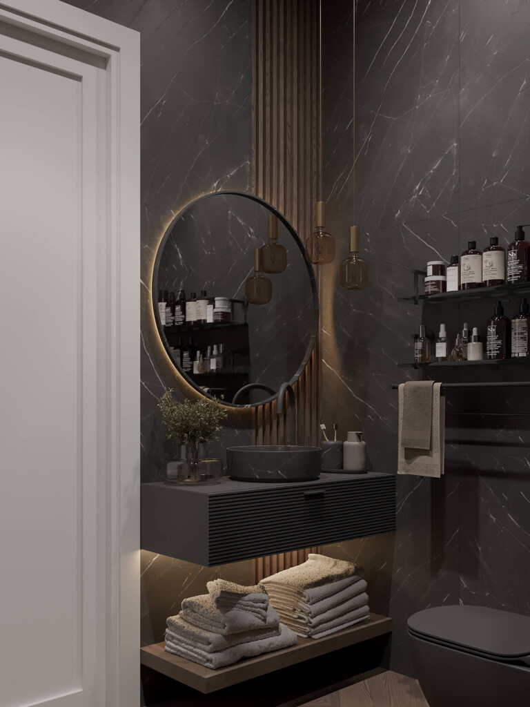 Projekt łazienki 3m2 w bloku z okrągłym podświetlanym lustrem, czarną umywalką nablatową i otwartą półką na ręczniki