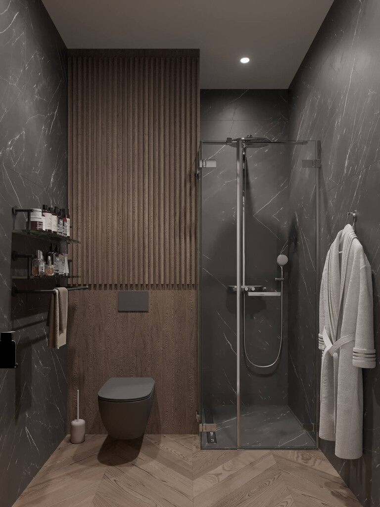 Mała łazienka 3m2 w bloku z prysznicem, wiszącym WC i ścianą z drewnianych lameli na tle ciemnych płytek