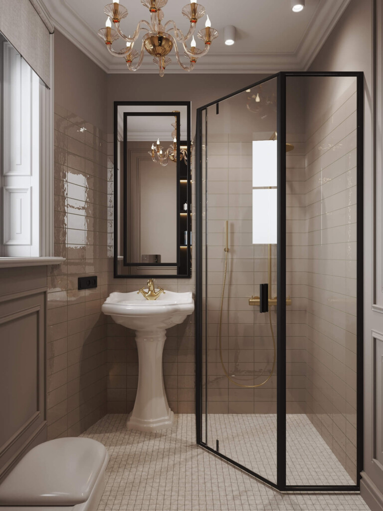 Mała łazienka 5m2 z narożnym prysznicem, umywalką na postumencie, złotą baterią i dekoracyjnym żyrandolem sufitowym